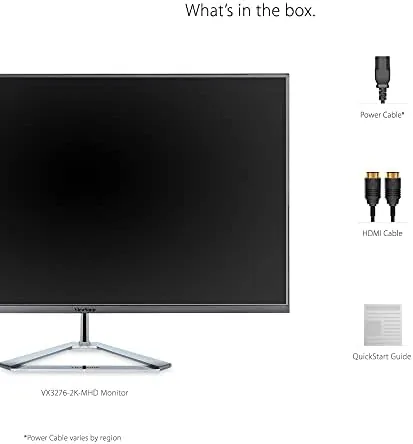 A clean desk setup with the monitor connected to a Mac and PC