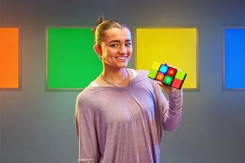 Child flipping the colored blocks to match the center lights