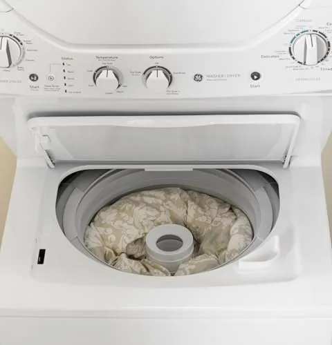 Clean laundry being pulled from the dryer drum of the Spacemaker