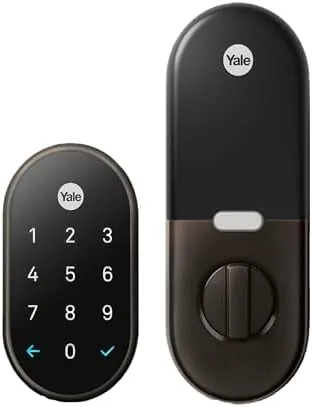 Google Nest x Yale lock in oil rubbed bronze mounted on a front door