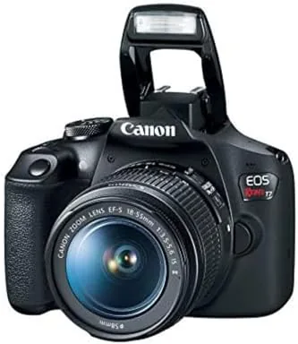 A photographer holding the Rebel T7 while walking outdoors
