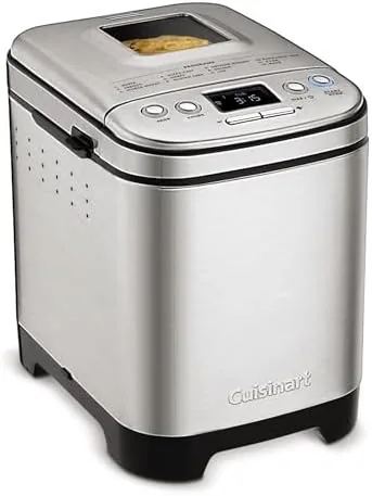 Cuisinart bread maker on a counter with the lid window visible