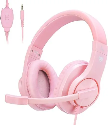 Pink gaming headset resting on a desk showing the over ear design