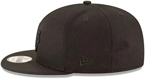 The cap hanging on a hook beside a jacket