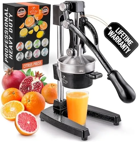 The orange Zulay cast iron juicer with a glass of fresh juice