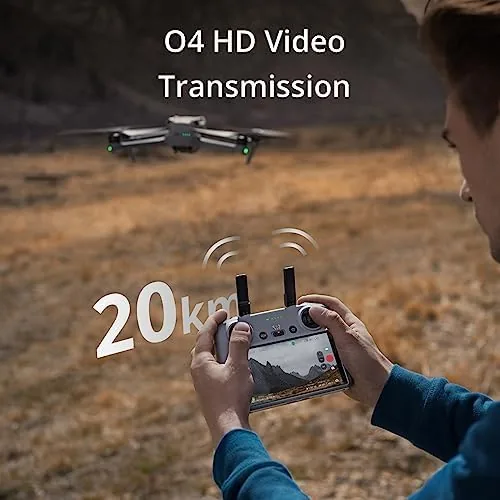 A pilot holding the DJI RC 2 while a drone hovers in the distance