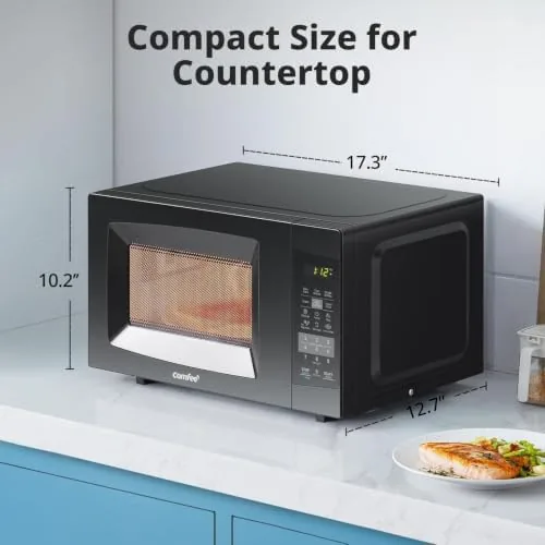 The COMFEE microwave next to a larger 0.9 cubic foot microwave