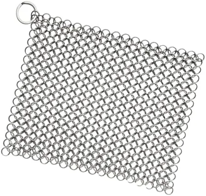 Stainless steel chainmail scrubber resting on a <a href=