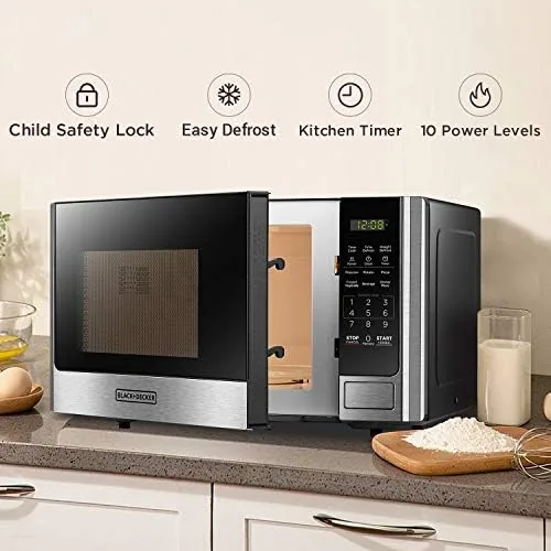 Compact kitchen with the 0.9 cu ft microwave on a tight counter