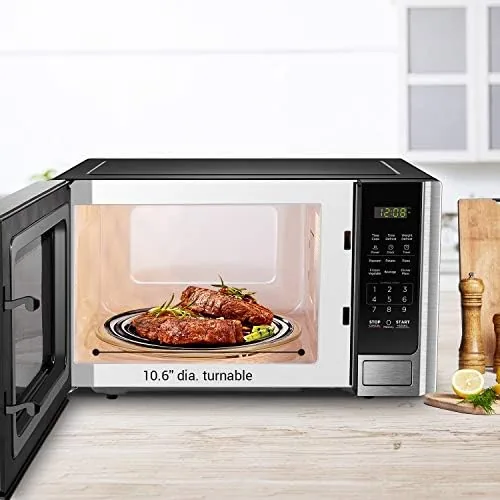 Hot cup of coffee warming in the BLACK+DECKER 0.9 cu ft microwave