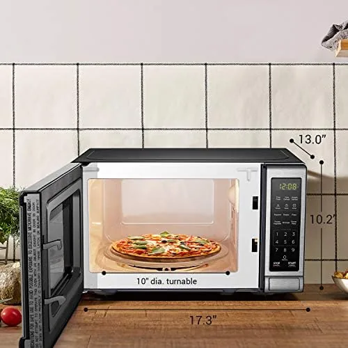 Mug of tea warming in the compact BLACK+DECKER microwave
