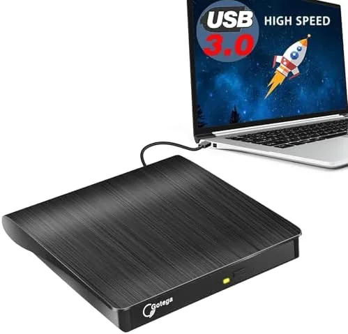 The external USB-A CD/DVD drive on a desk with a disc in the tray