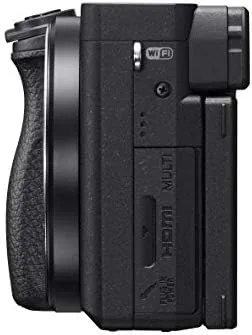 A vlogger using the Sony a6400 with the flip screen facing forward