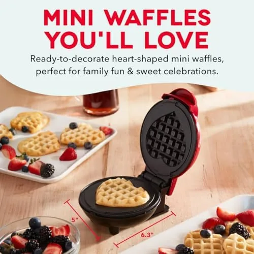 A heart-shaped waffle lifted from the open <a href=