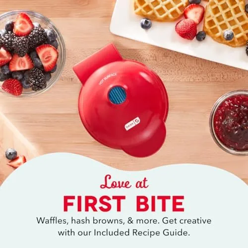 A stack of heart-shaped mini waffles on a breakfast plate