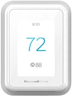 The Honeywell Home T9 smart thermostat mounted on a hallway wall