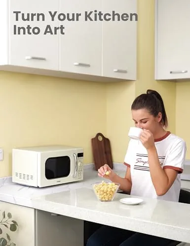 Cream retro microwave styled among pastel kitchen accessories
