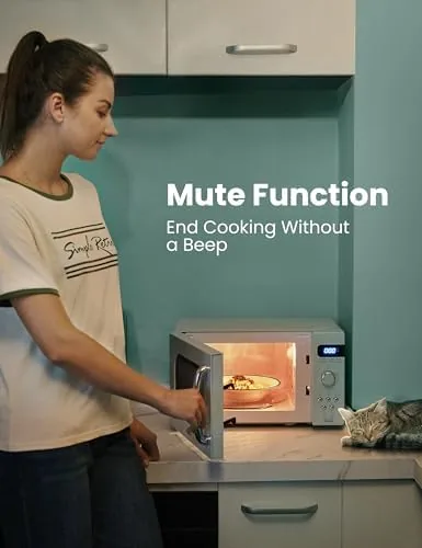 A hot meal being lifted out of the green retro microwave