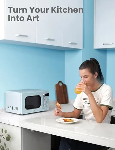 Green retro microwave styled in a pastel kitchen setting