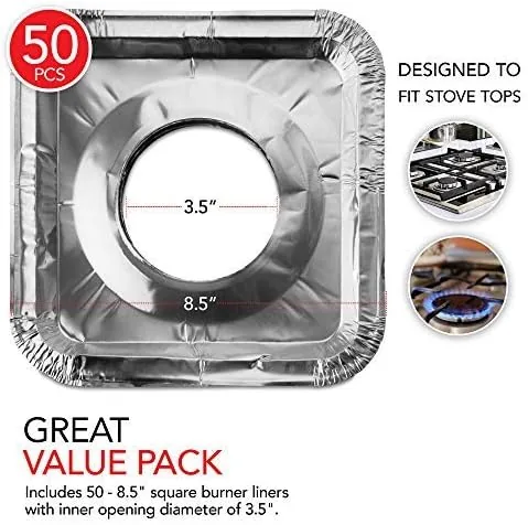 A used foil liner lifted from the stove showing collected grease