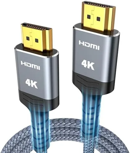The Highwings braided HDMI cable coiled on a coffee table next to a remote