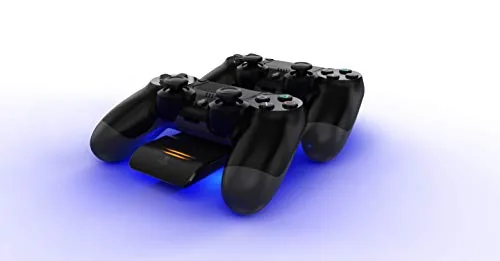 Two controllers charging on the dock in a tidy living room setup