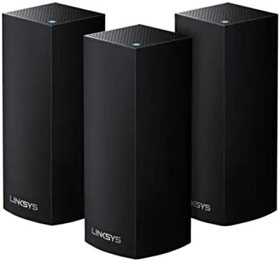 The three Linksys Velop AC6600 nodes standing together on a shelf