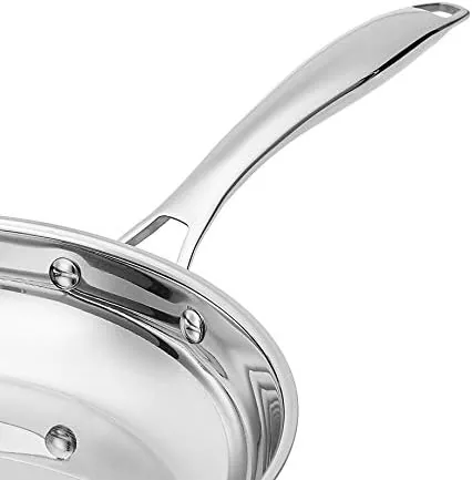 Two skillets cooking on an induction cooktop with even heating