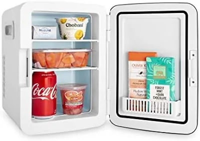 The white Cooluli mini fridge tucked onto a closet shelf