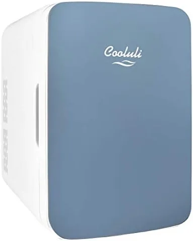 The blue Cooluli 10L mini fridge on an office desk