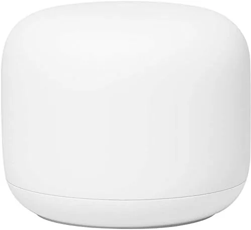 The Google Nest Wifi router sitting on a bookshelf in a living room, blending with the decor