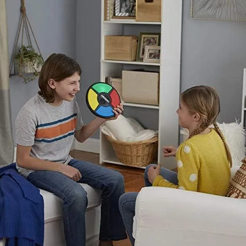 Hands passing the Simon game between two players at a table