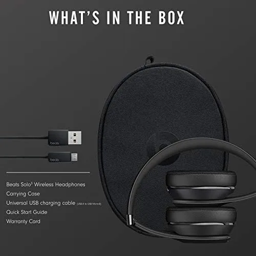 Beats Solo3 Wireless on a desk with a charging cable connected