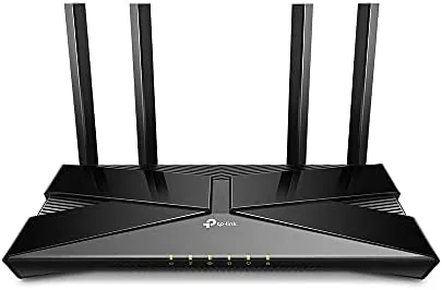 TP-Link Archer AX10 router standing upright on a living room shelf
