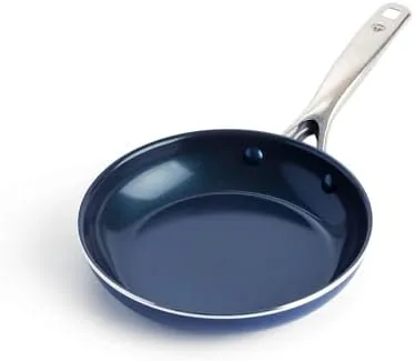 Blue Diamond 8 inch ceramic frying pan with its blue finish on a stovetop