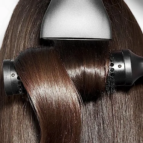 ghd Helios hair dryer with its slim nozzle on a vanity