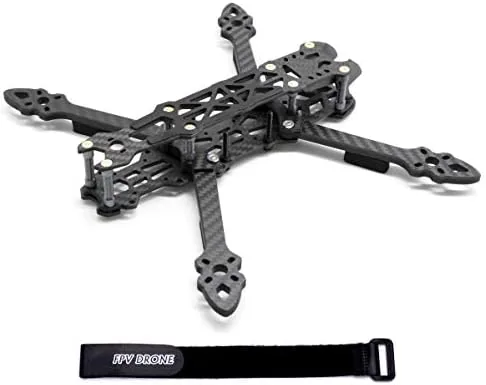 225mm carbon fiber FPV drone frame kit laid out on a workbench