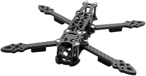 Finished FPV quadcopter in the air against a bright sky