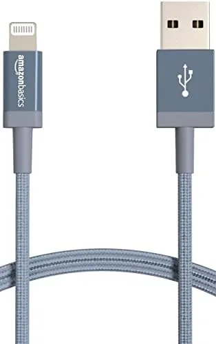 Dark gray braided Amazon Basics Lightning cable coiled on a desk