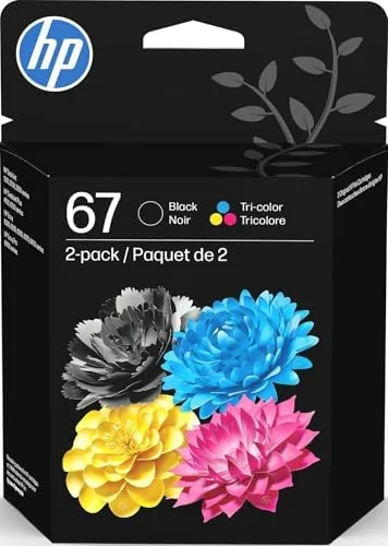 The HP 67 black and tri-color cartridges outside their packaging on a desk