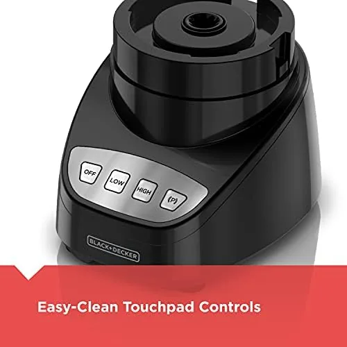 The stainless steel S-blade held next to the food processor base