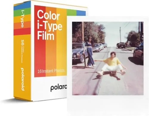 A collection of developed instant photos arranged on a table
