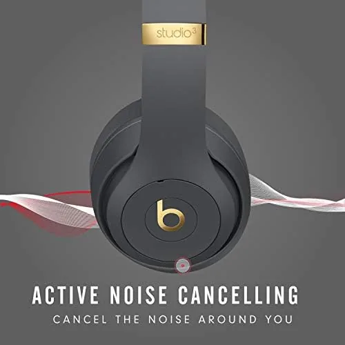 Beats Studio3 Wireless worn by a traveler in an airport seat