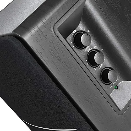 Close-up of the Edifier R1280DBs front controls and remote control