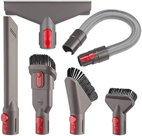 Dyson attachment kit tools laid out on a table