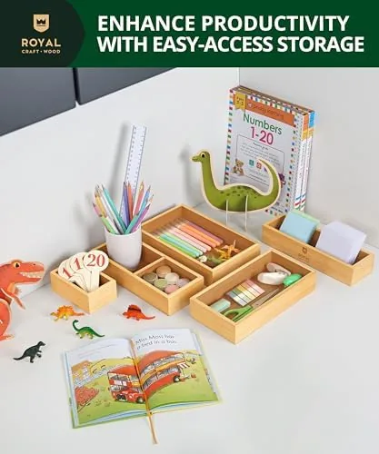 Office desk drawer with bamboo organizers holding cables and supplies