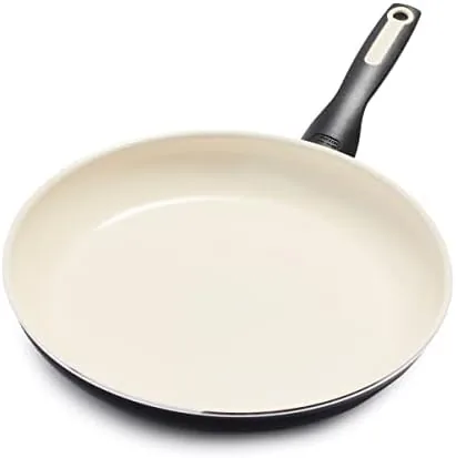 The GreenPan Rio 12 inch ceramic nonstick skillet on a stovetop