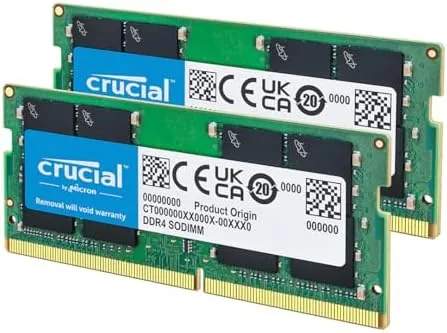 Open laptop showing the SODIMM slot with the new 16GB module installed beside the heatsink