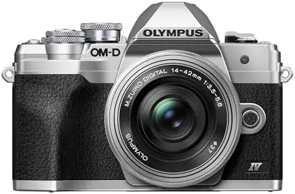 Silver Olympus OM-D E-M10 Mark IV body with the collapsed 14-42mm EZ kit lens attached