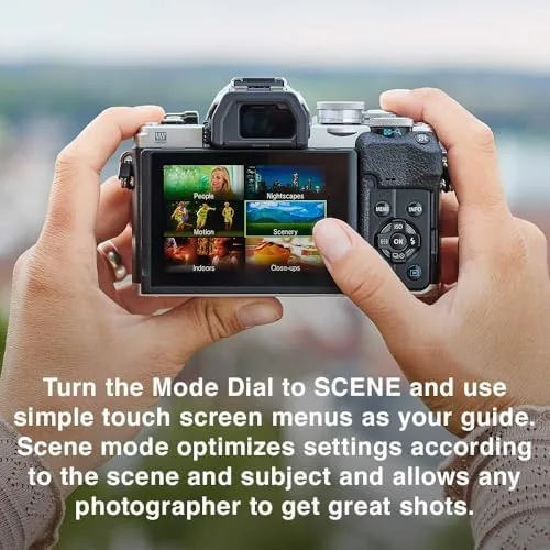 The E-M10 Mark IV with the 14-42mm lens extended, held in one hand
